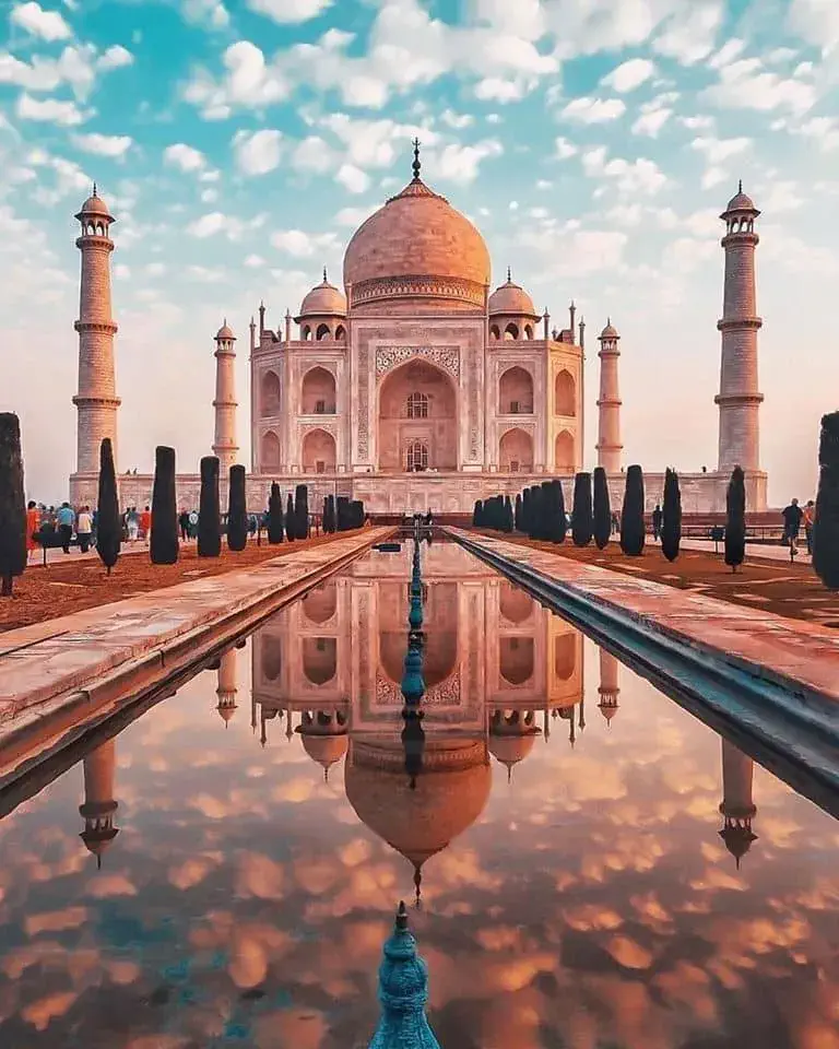Magnificent Taj Mahal in India, a white marble masterpiece reflecting in the pool, symbolizing eternal love and architectural beauty.