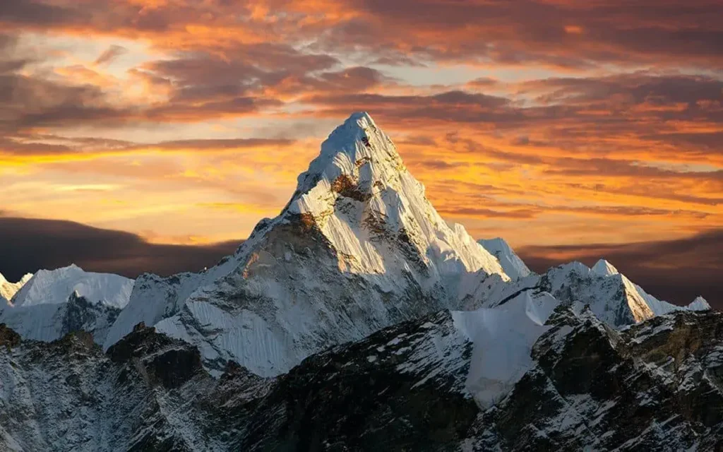 A collage of the top 10 tallest mountains in the world, showcasing their majestic peaks and snow-capped summits, inviting adventurers to embark on a thrilling journey to conquer these iconic mountain giants
