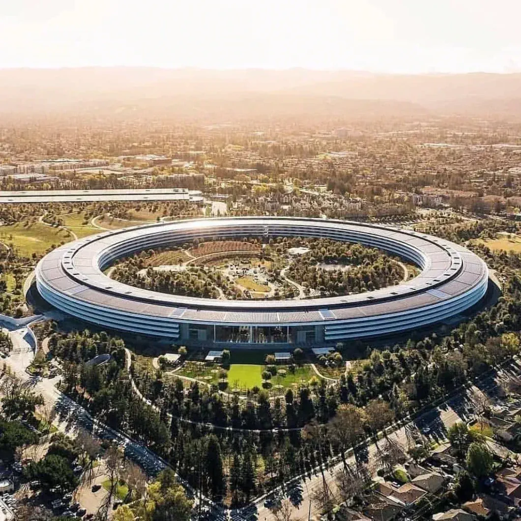 Experience the groundbreaking Apple Park, a blend of technology and nature, featuring innovative architecture and eco-friendly design that redefine the modern workplace environment.